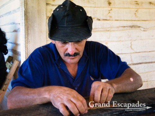 A tobacco farmer demonstrating how to roll cigars, near Vinales, Cuba