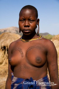 The most distinctive of all ethnic groups in the Omo Valley: the Mursi, famous for the huge Lip Plates the women are sporting. Mago National Park, near Jinka, Lower Omo Valley, South Ethiopia