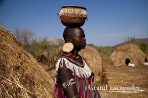The most distinctive of all ethnic groups in the Omo Valley: the Mursi, famous for the huge Lip Plates the women are sporting. Mago National Park, near Jinka, Lower Omo Valley, South Ethiopia