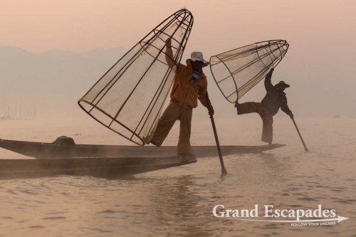 Fishermen on Inle Lake, Myanmar - Them rowing their boats with one leg contributed to making the lake a legend. This technique allows them to throw / pull their nets with both hands.