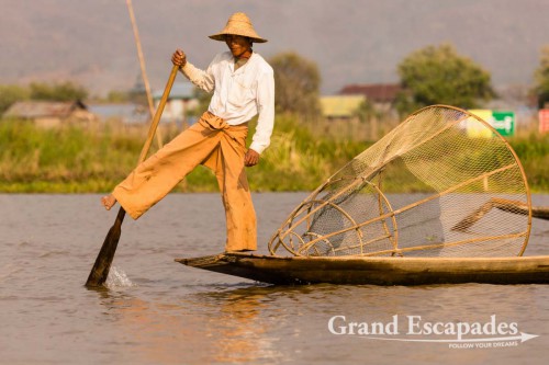 Fishermen on Inle Lake, Myanmar - Them rowing their boats with one leg contributed to making the lake a legend. This technique allows them to throw / pull their nets with both hands.
