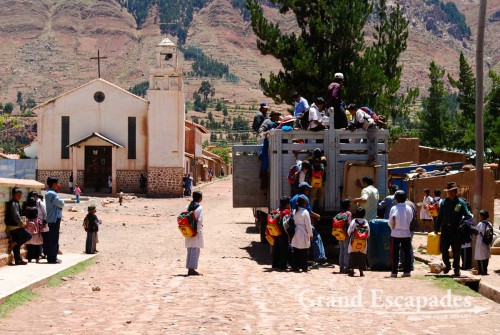 In Potolo, kids get on the truck that takes them home after school, near Sucre, Bolivia