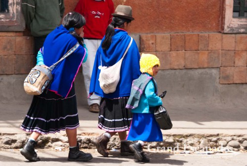 Blue skirts, thin hand-woven ponchos and a bowler hat, Guambiano Indigenous Market, Silvia, near Popayan, Cauca, Colombia, South America