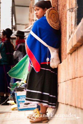 Blue skirts, thin hand-woven ponchos and a bowler hat, Guambiano Indigenous Market, Silvia, near Popayan, Cauca, Colombia, South America