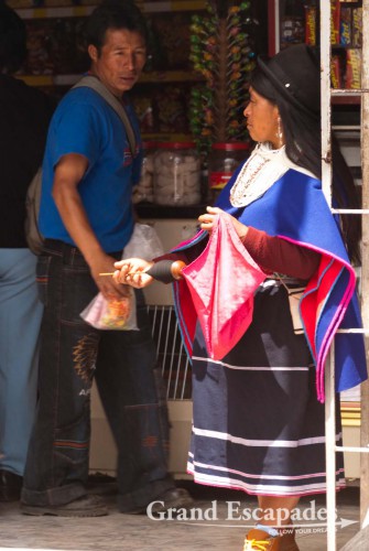 Blue skirts, thin hand-woven ponchos and a bowler hat, Guambiano Indigenous Market, Silvia, near Popayan, Cauca, Colombia, South America