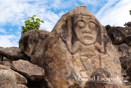 Faces are carved into the rocks, La Chaquira, above the Rio Magdalena, San Agustin, Huila, Colombia, South America