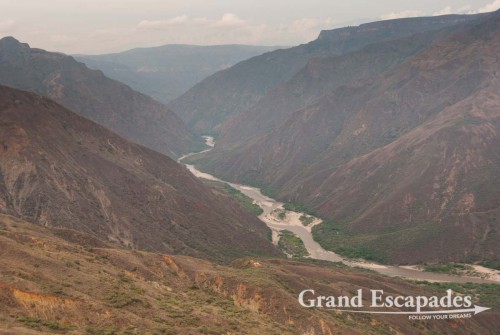 For those wondering if it is worth dishing out the 30.000 COP or 15 USD for the 6 kilometer ride down and up to the other rim, La Mesa de Los Santos, well, the best view of the canyon is actually from the ?Mirador? high above on the side of the entrance gate, because you have a 360 degree view and can see the river?s meandering around a mountain