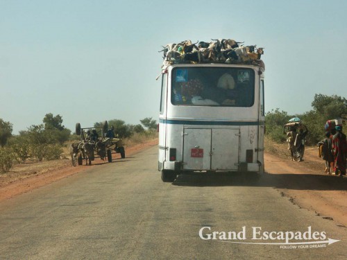 The only tared road in Mali, between Bamako and Gao. The bus is loaded with sheep for the Aid El Kebir - Remember that 95% of the Malians are Moslem