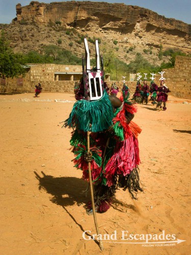 Of course, the "Police" is watching: no women or children shall come near the Masks. There, posing for the photo ... "Festival des Masques”, an old tradition of the Dogon Country, in the village of Ende, Dogon Country, Mali
