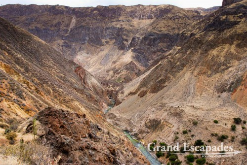 Trekking the Canyon de Colca, the 2nd deepest Canyon on earth, Cabanaconde, Peru - View of the Colca Canyon with Rio Colca in the bottom ...