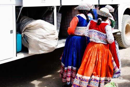 Local women in traditional dress selling souvenirs of wool or Alpaca - Cabanaconde, Colca Canyon, Peru