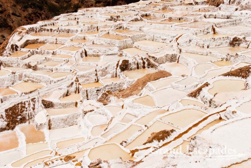 The salt pans near Maras are are fed by a little salty river that emerges from the mountain, near Cuzco, the Sacred Valley, Peru