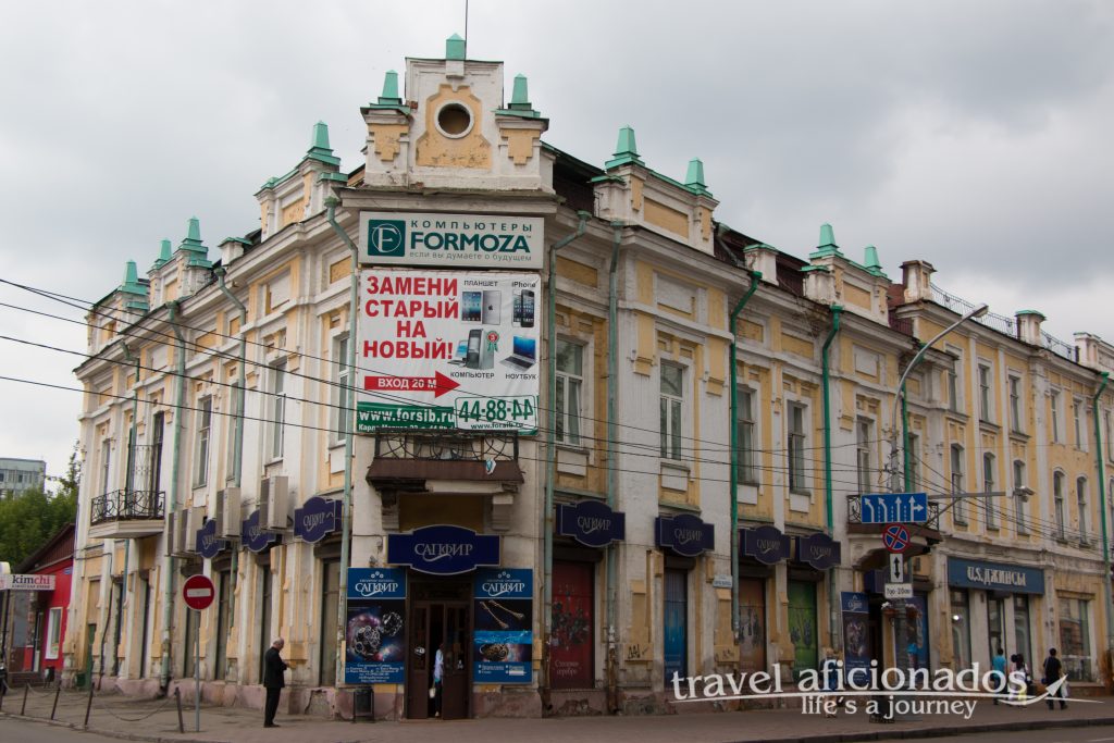 Irkutsk's beautiful houses are dominated by advertisements
